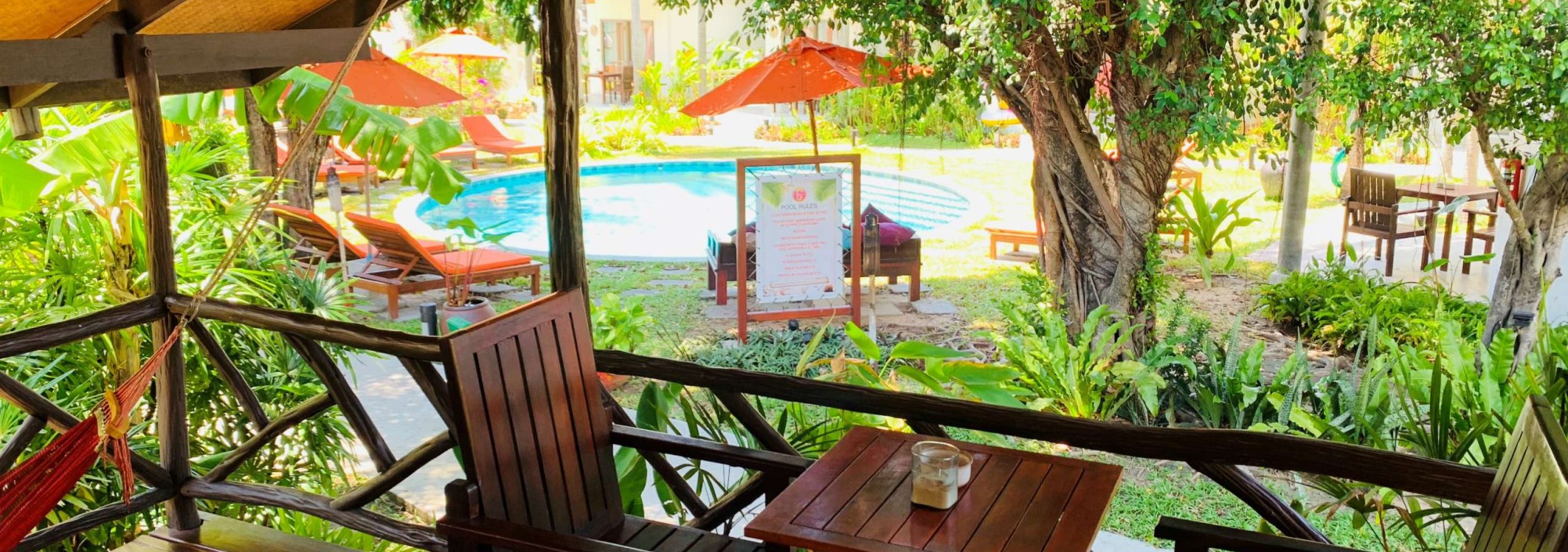 secret-garden-samui-classic-pool-view-bungalow-patio-view-over-pool-thailandtravel